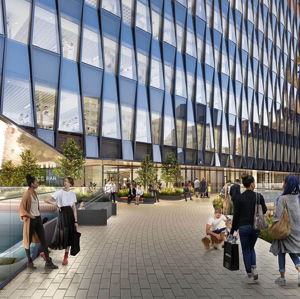 People walking across a designer open-air connection bridge